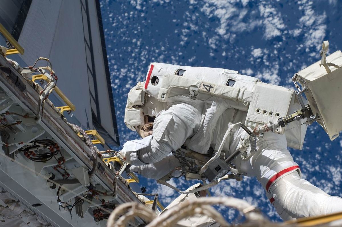 Russian Cosmonaut Makes History with First Ride on European Robotic Arm in Spacewalk